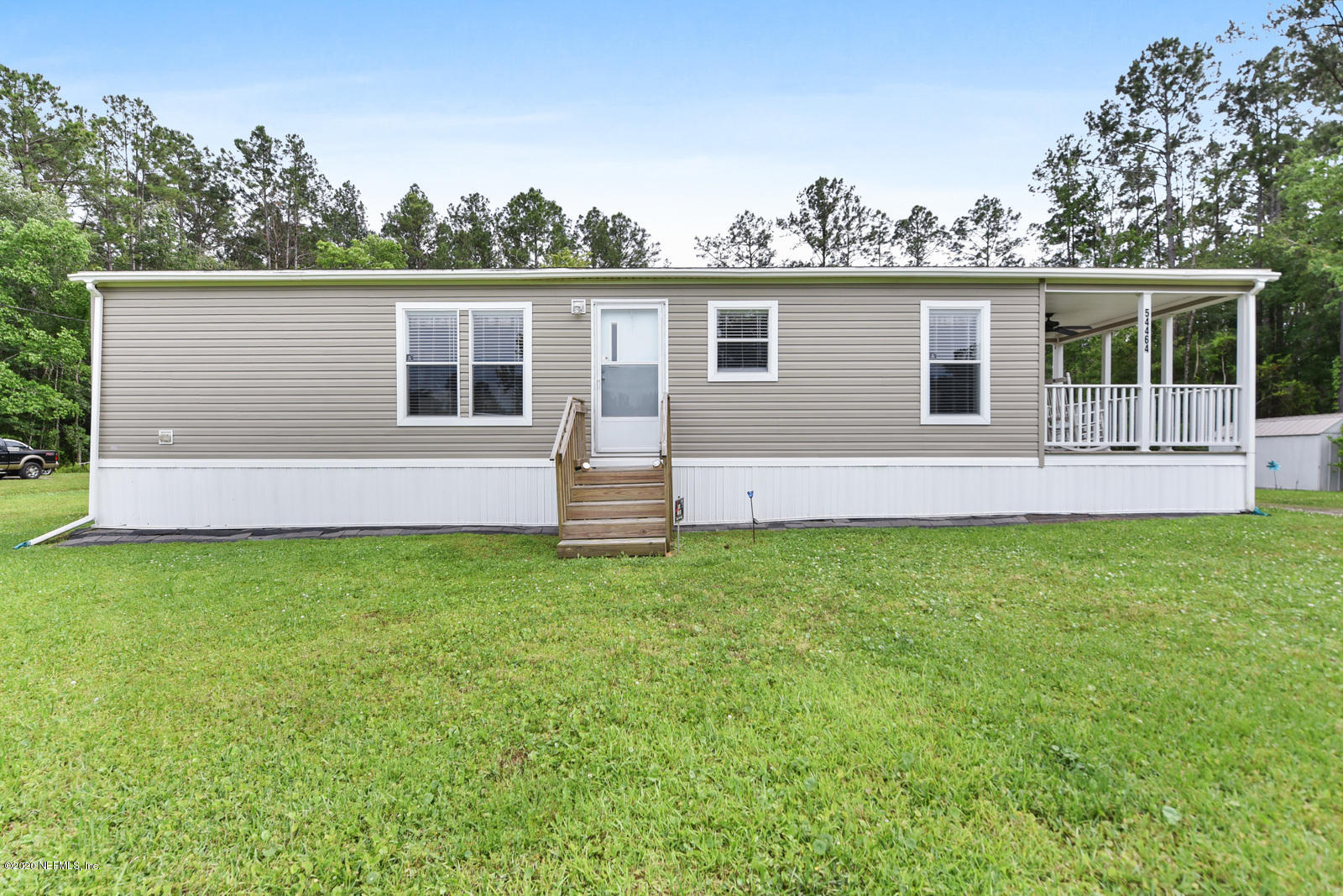 54464 Sherwood Road Callahan, FL 32011 - Photo 4 of 25 front view of house with a yard