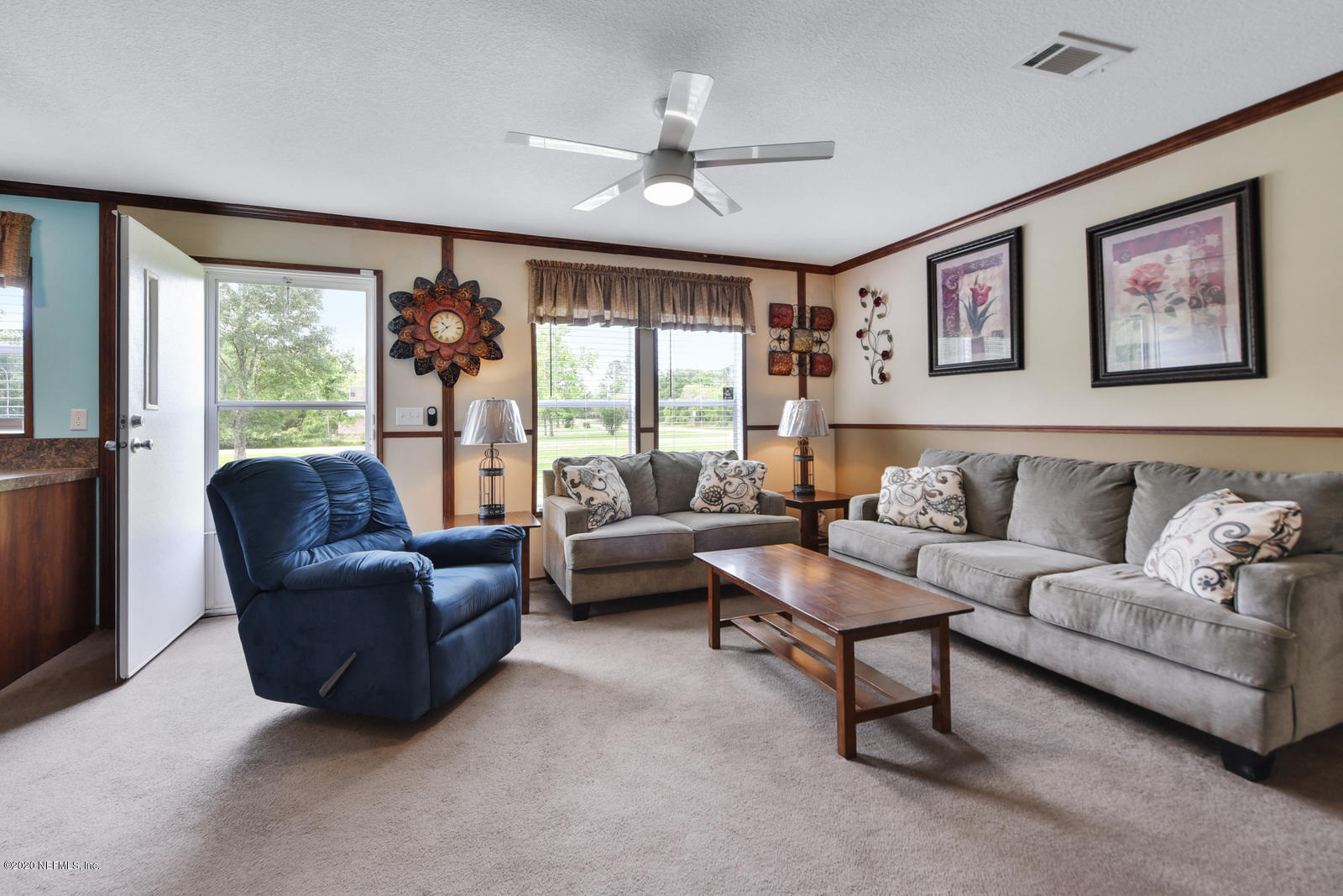 54464 Sherwood Road Callahan, FL 32011 - Photo 5 of 25 a living room with furniture and a large window