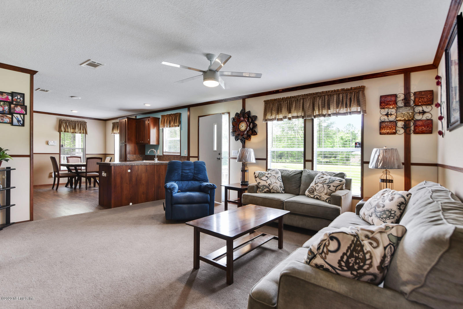 54464 Sherwood Road Callahan, FL 32011 - Photo 6 of 25 a living room with furniture and large windows