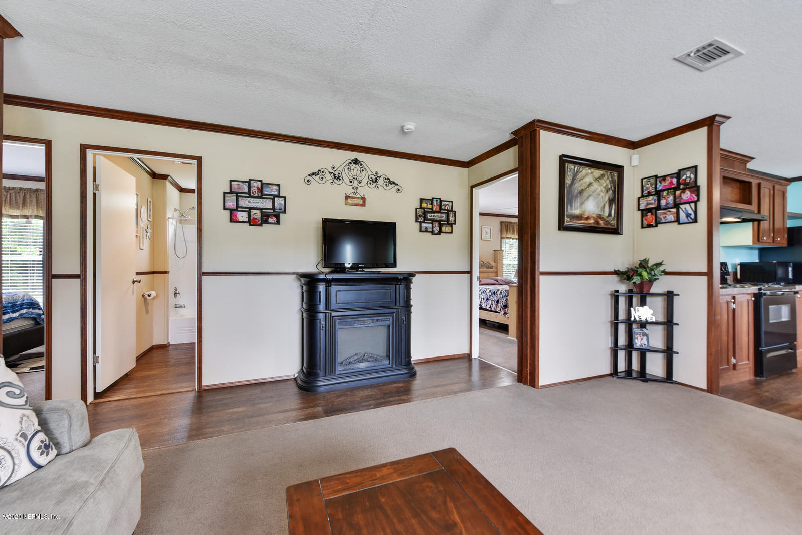 54464 Sherwood Road Callahan, FL 32011 - Photo 7 of 25 a view of a livingroom with furniture and an empty room
