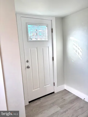 an empty room with wooden floor