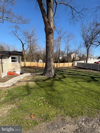 a view of yard with swimming pool