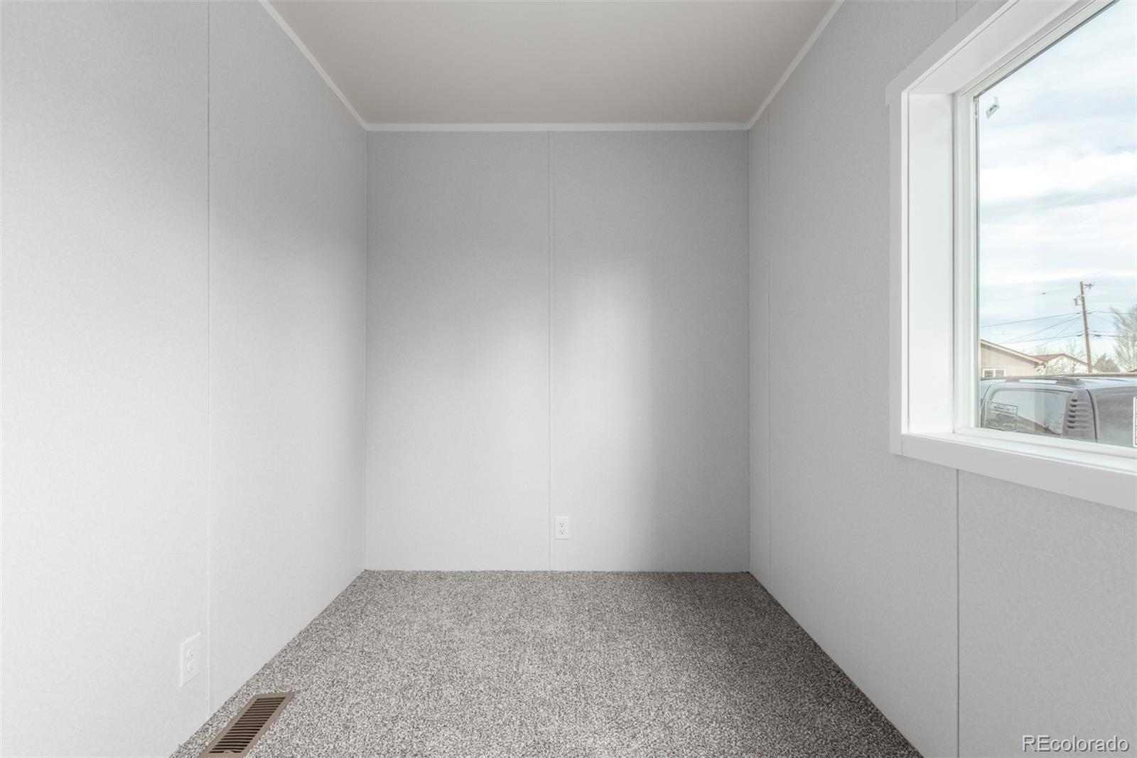 105 Longs Street Brighton, CO 80601 - Photo 19 of 27 an empty room with a window