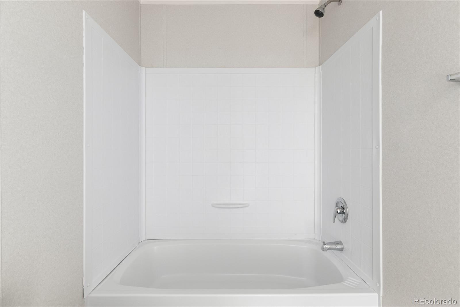 105 Longs Street Brighton, CO 80601 - Photo 21 of 27 a bathroom with a bathtub