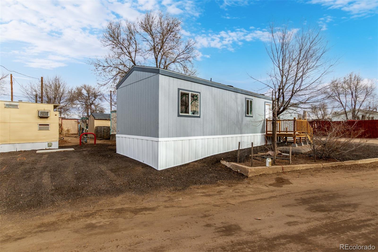 105 Longs Street Brighton, CO 80601 - Photo 22 of 27 a view of a house with a yard