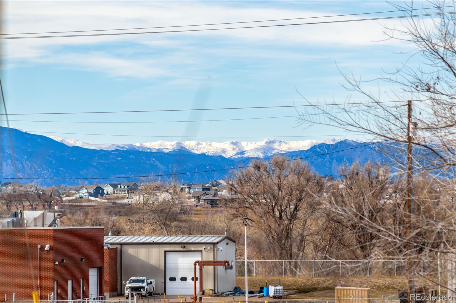 105 Longs Street Brighton, CO 80601 - Photo 26 of 27 a view of a city with tall buildings