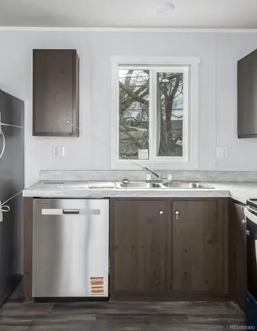 a kitchen with a stove and a refrigerator