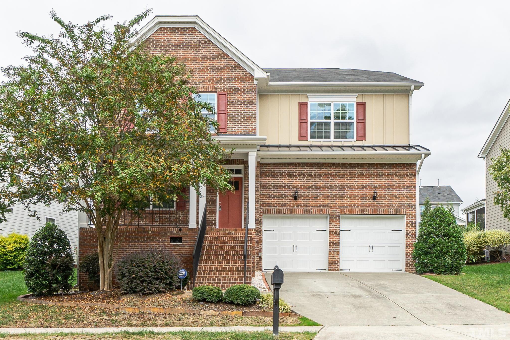 a front view of a house with garage