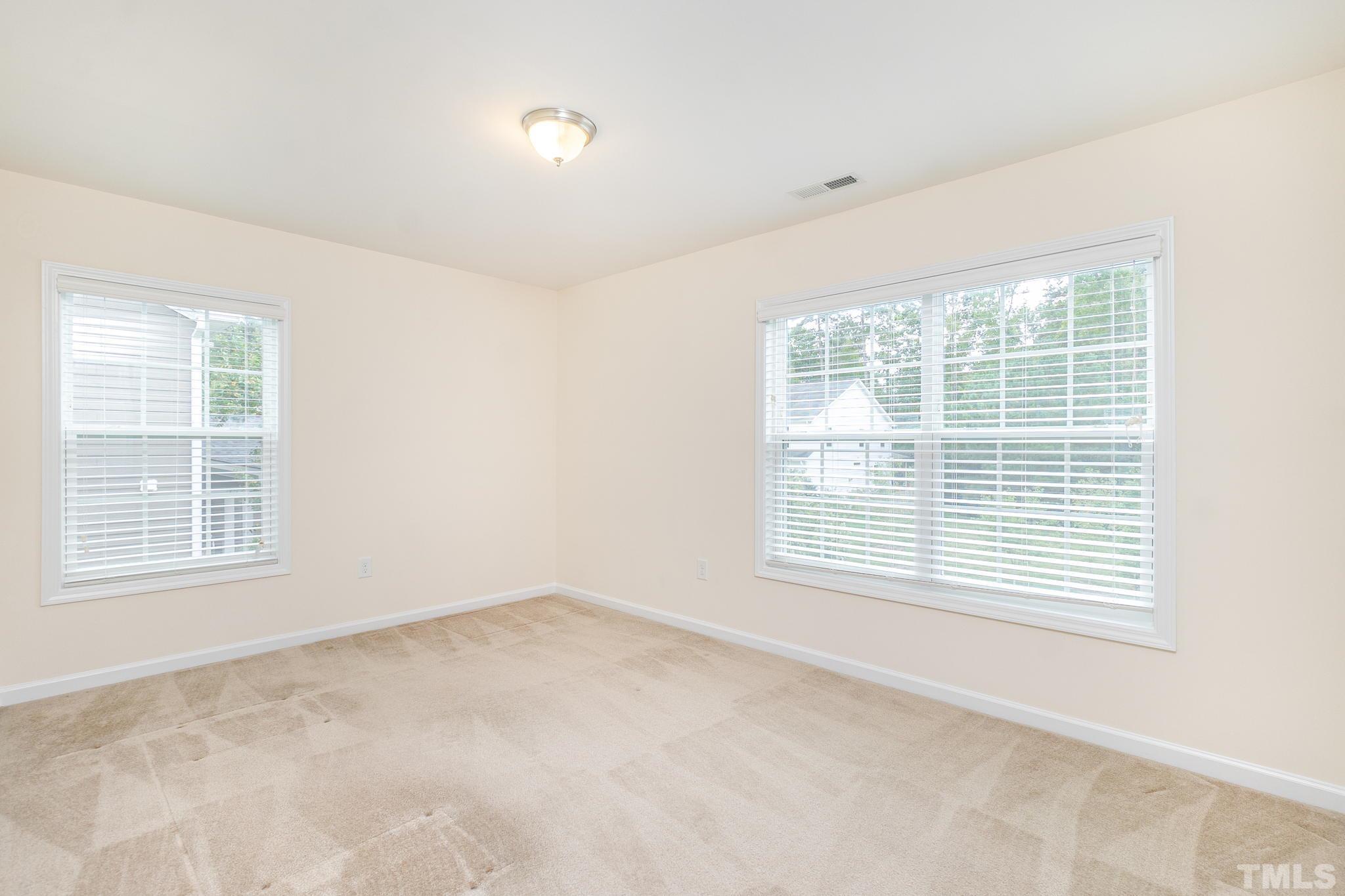 222 Strolling Way Durham, NC 27707 - Photo 21 of 26 a view of an empty room with a window