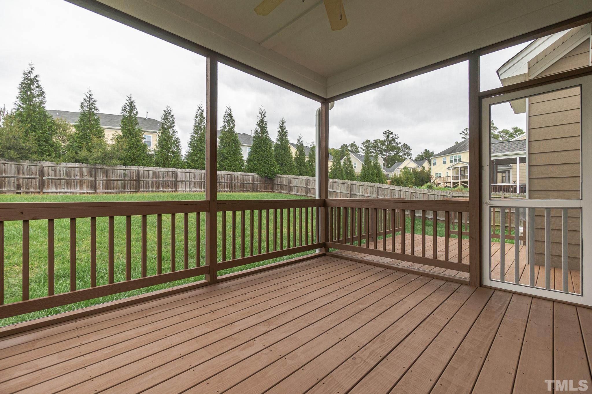 222 Strolling Way Durham, NC 27707 - Photo 26 of 26 a view of a wooden deck with a yard