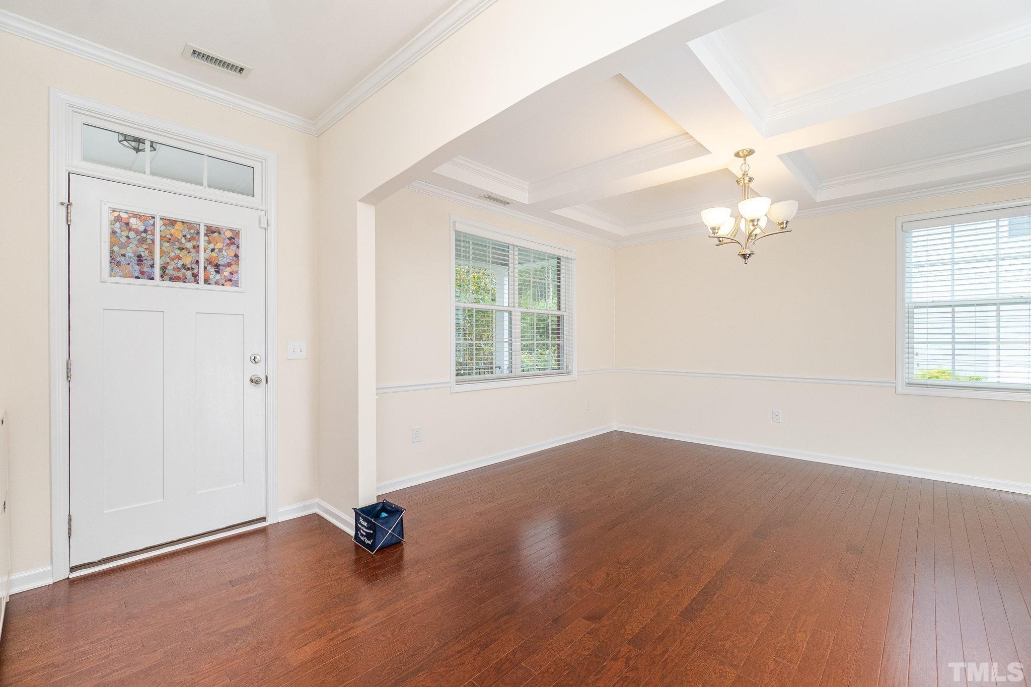 222 Strolling Way Durham, NC 27707 - Photo 4 of 26 wooden floor in an empty room with a window
