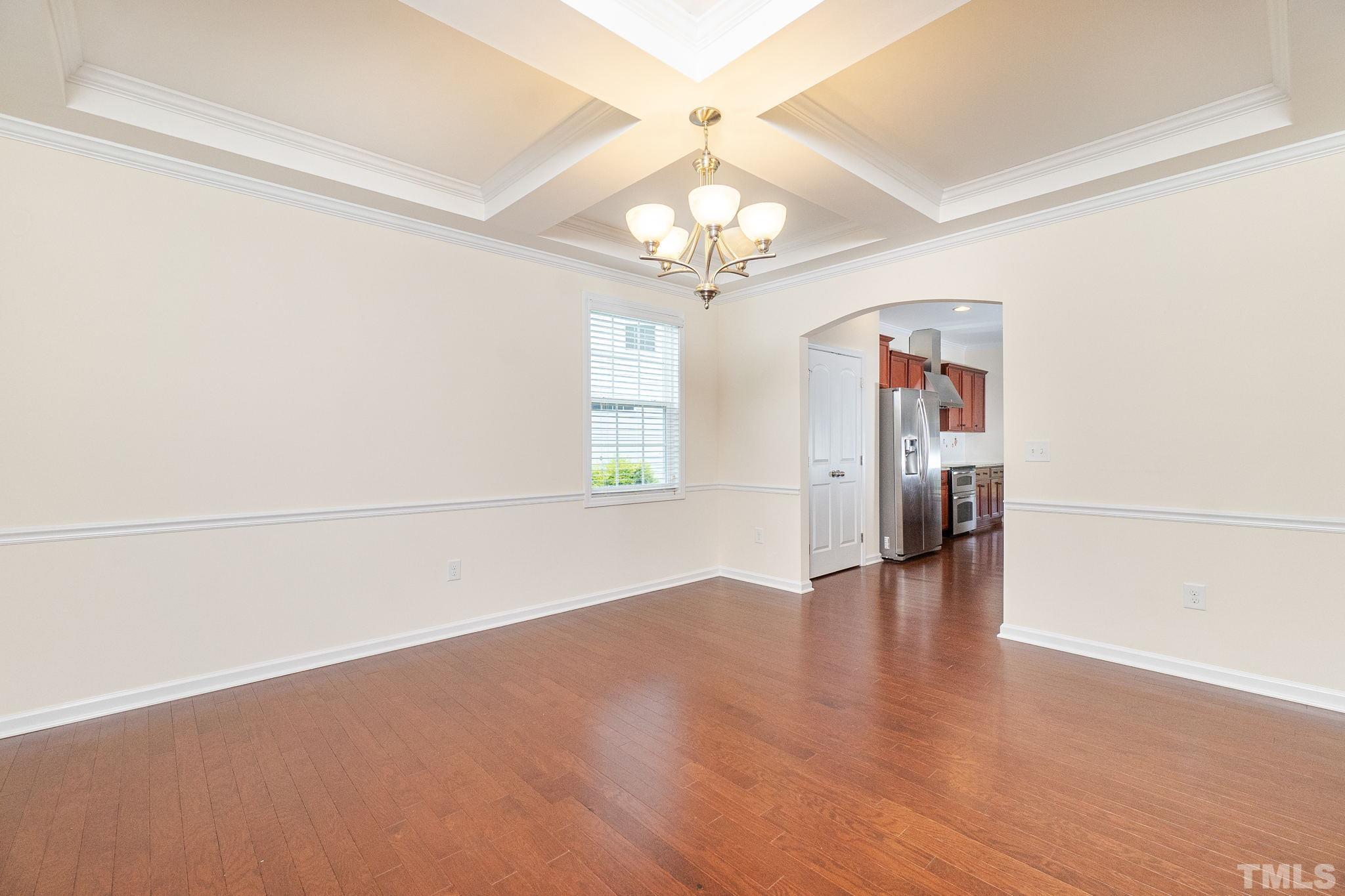 222 Strolling Way Durham, NC 27707 - Photo 5 of 26 wooden floor in an empty room with a window