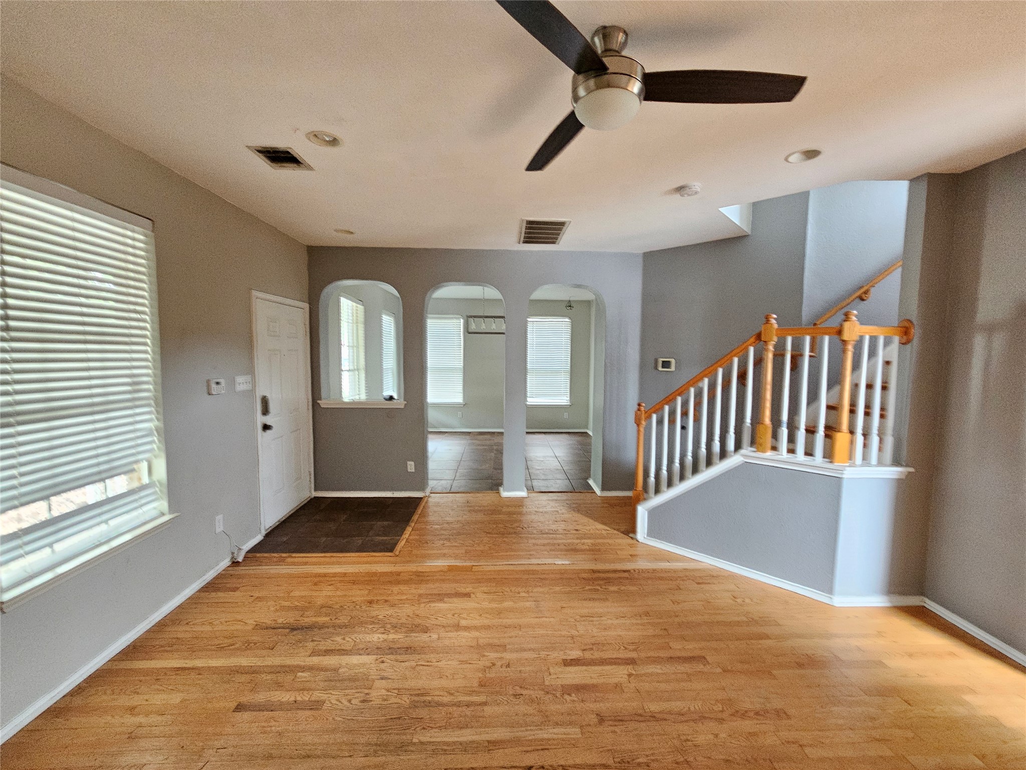 4672 Mather Kyle, TX 78640 - Photo 2 of 28 a view of an empty room with a window and wooden floor