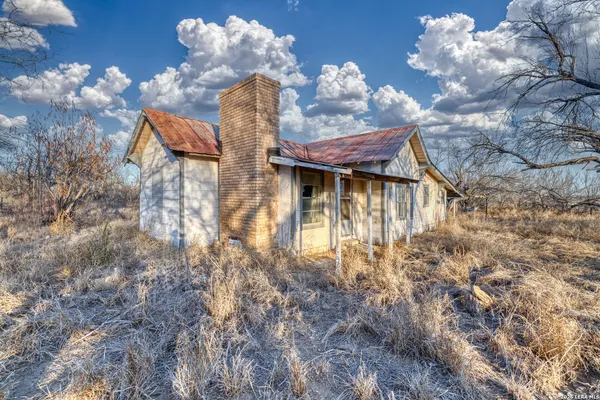 a front view of a house with lots of yellow lighting