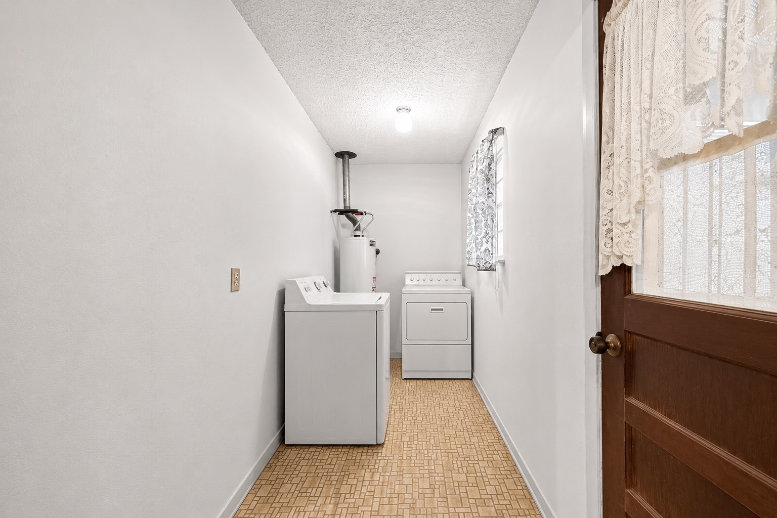 11105 Needville Fairchilds Road Needville, TX 77461 - Photo 8 of 24 a view of a room with washer and dryer