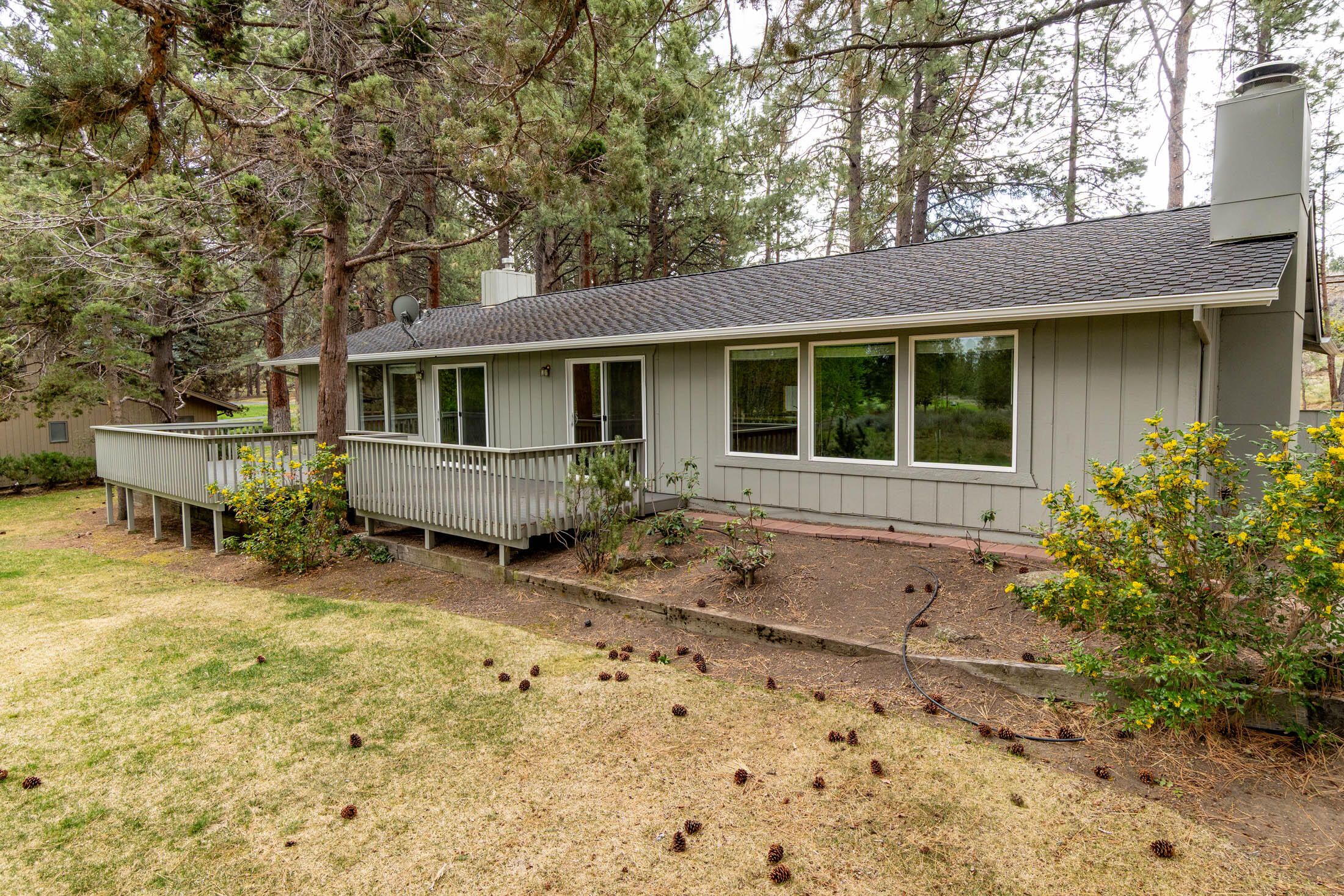 20316 Donkey Sled Road Bend, OR 97702 - Photo 26 of 50 a view of a house with a yard and sitting area