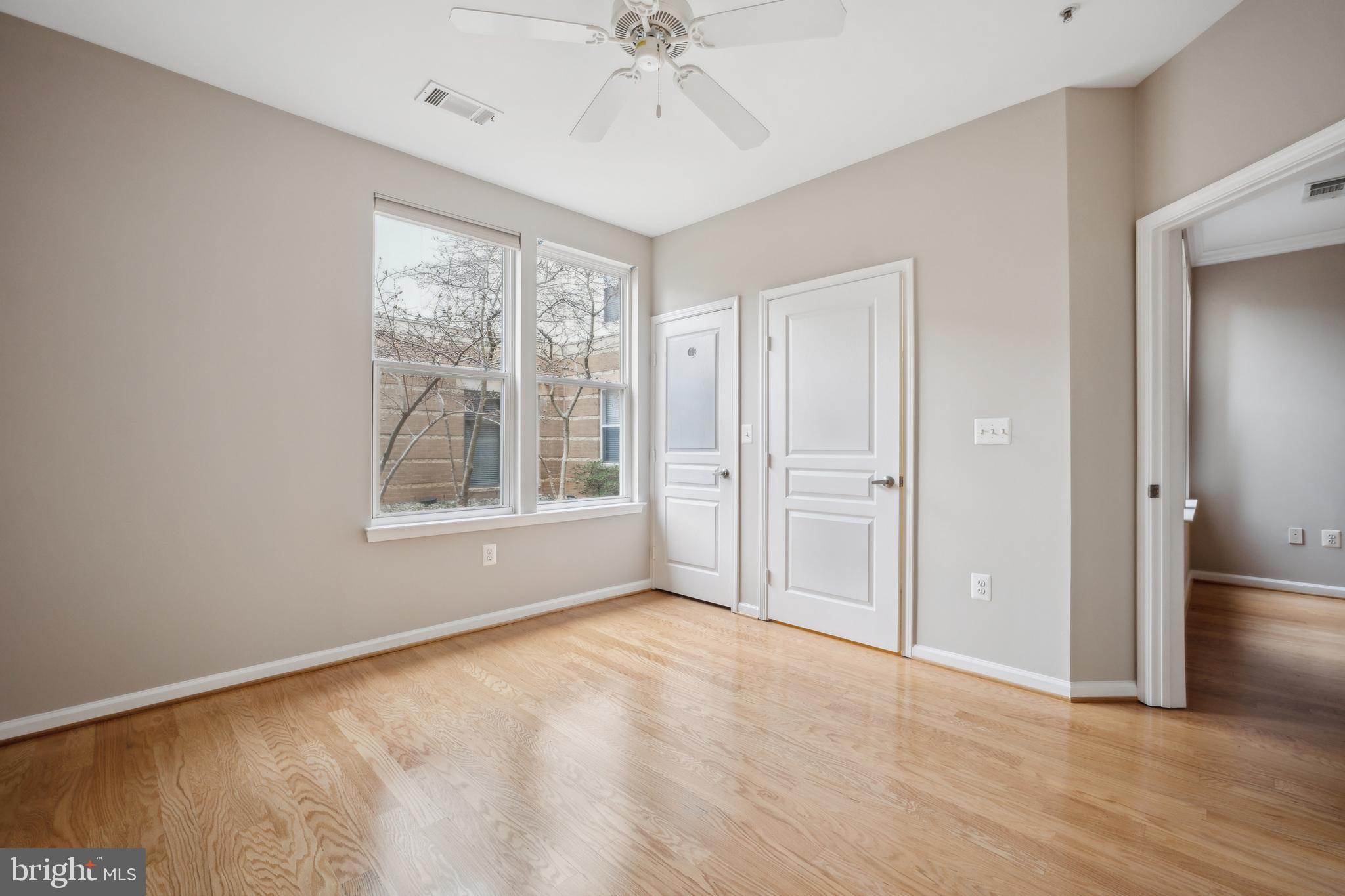 12001 Market Street, Unit 106 Reston, VA 20190 - Photo 14 of 26 a view of an empty room with a window