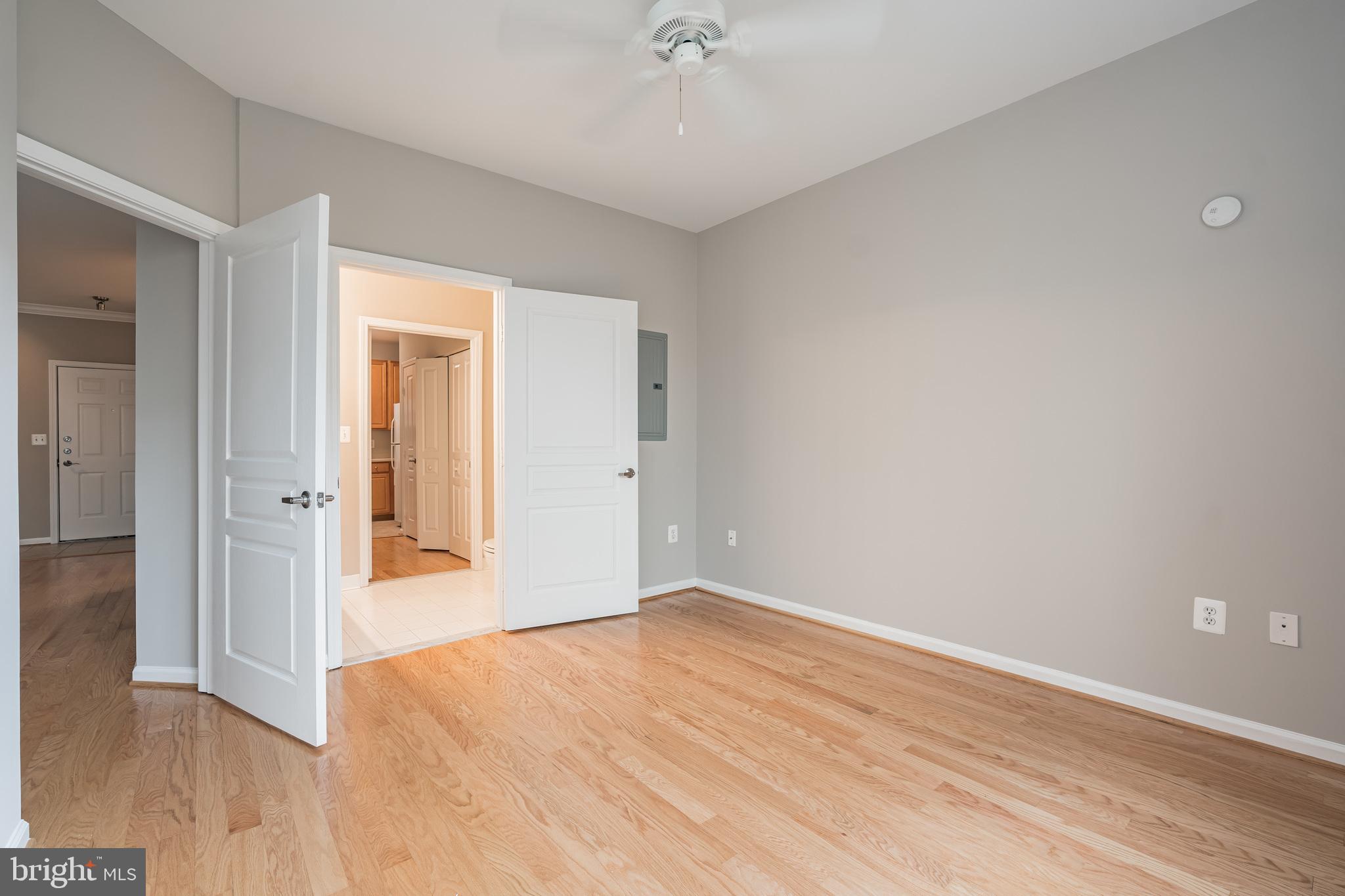 12001 Market Street, Unit 106 Reston, VA 20190 - Photo 16 of 26 wooden floor in an empty room