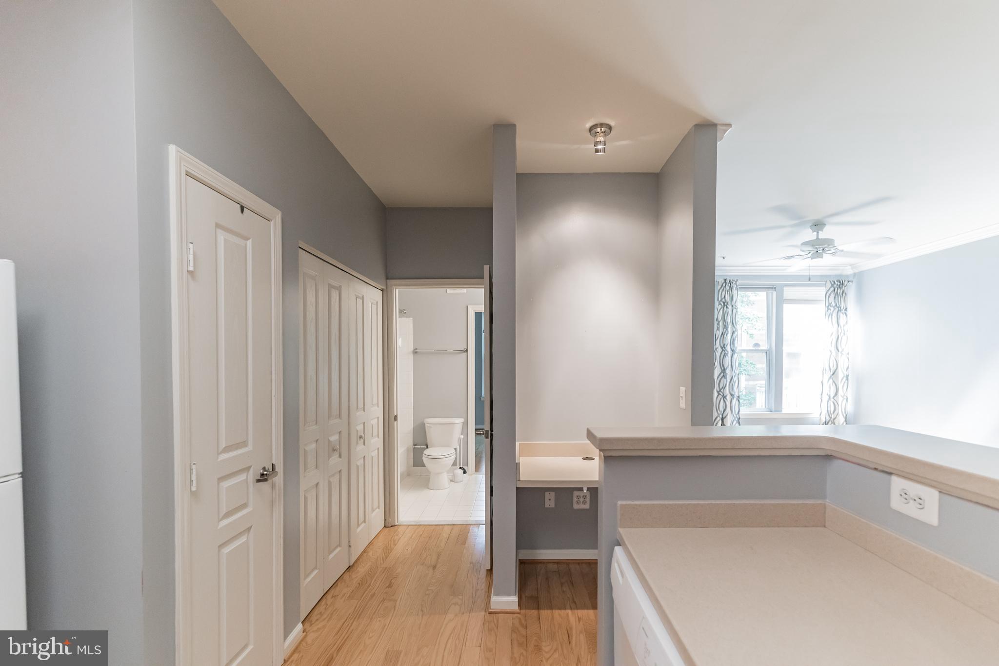 12001 Market Street, Unit 106 Reston, VA 20190 - Photo 18 of 26 a view of a bathroom with a tub and shower