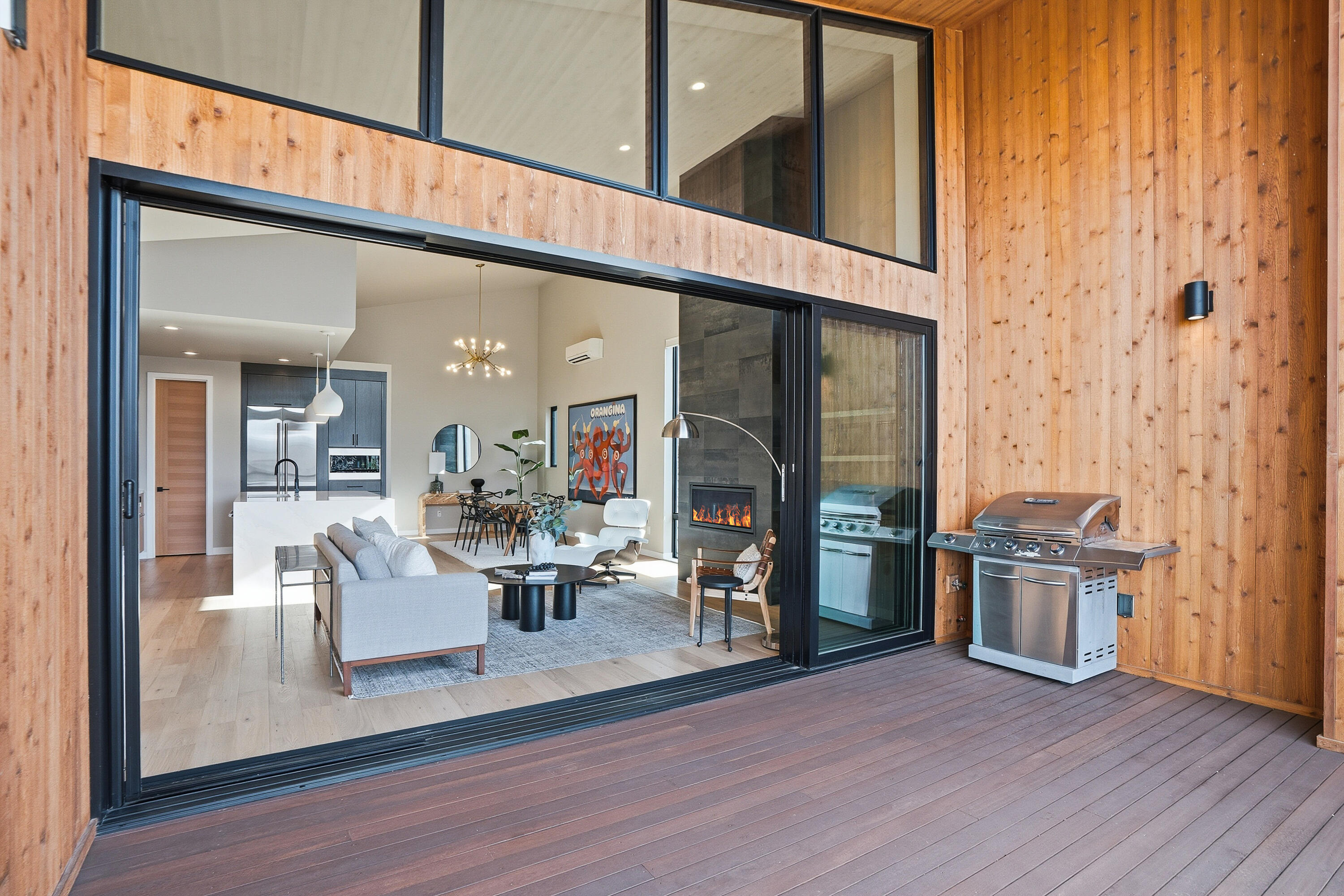 61250 Meeks Trail Bend, OR 97702 - Photo 12 of 43 a living room with furniture a wooden floor and a fireplace