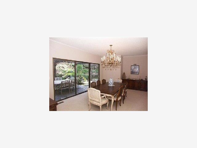 280 Robin Road Hillsborough, CA 94010 - Photo 3 of 8 a view of a dining room with furniture and chandelier
