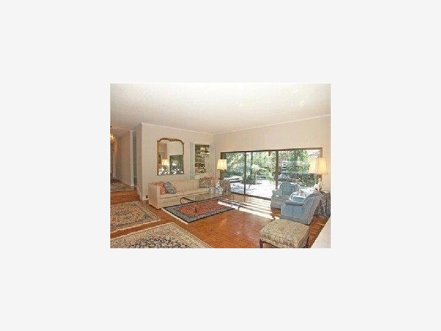 280 Robin Road Hillsborough, CA 94010 - Photo 5 of 8 a picture of a living room with a floor to ceiling window