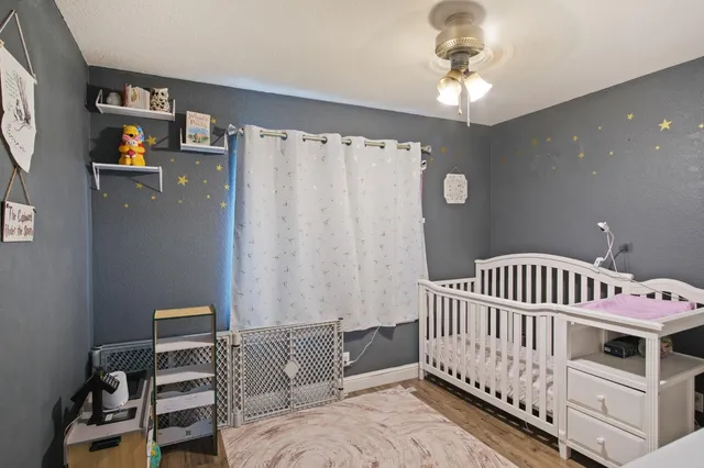a bedroom with furniture and a window