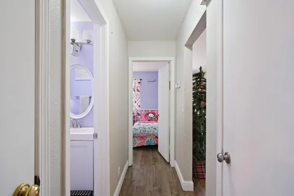 a view of an entryway with wooden floor