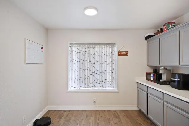 a kitchen with a window a sink and a cabinets