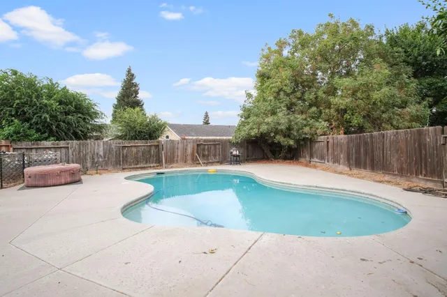 a view of a house with swimming pool