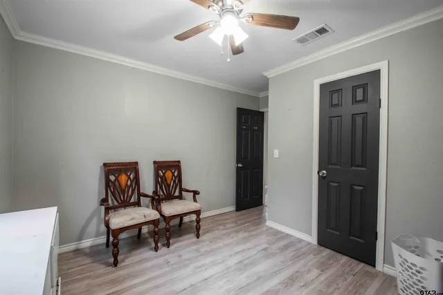 a view of a livingroom with furniture and wooden floor