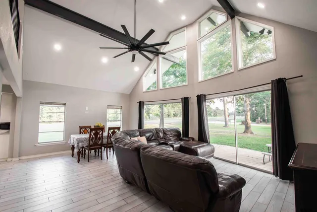 a living room with furniture and a large window