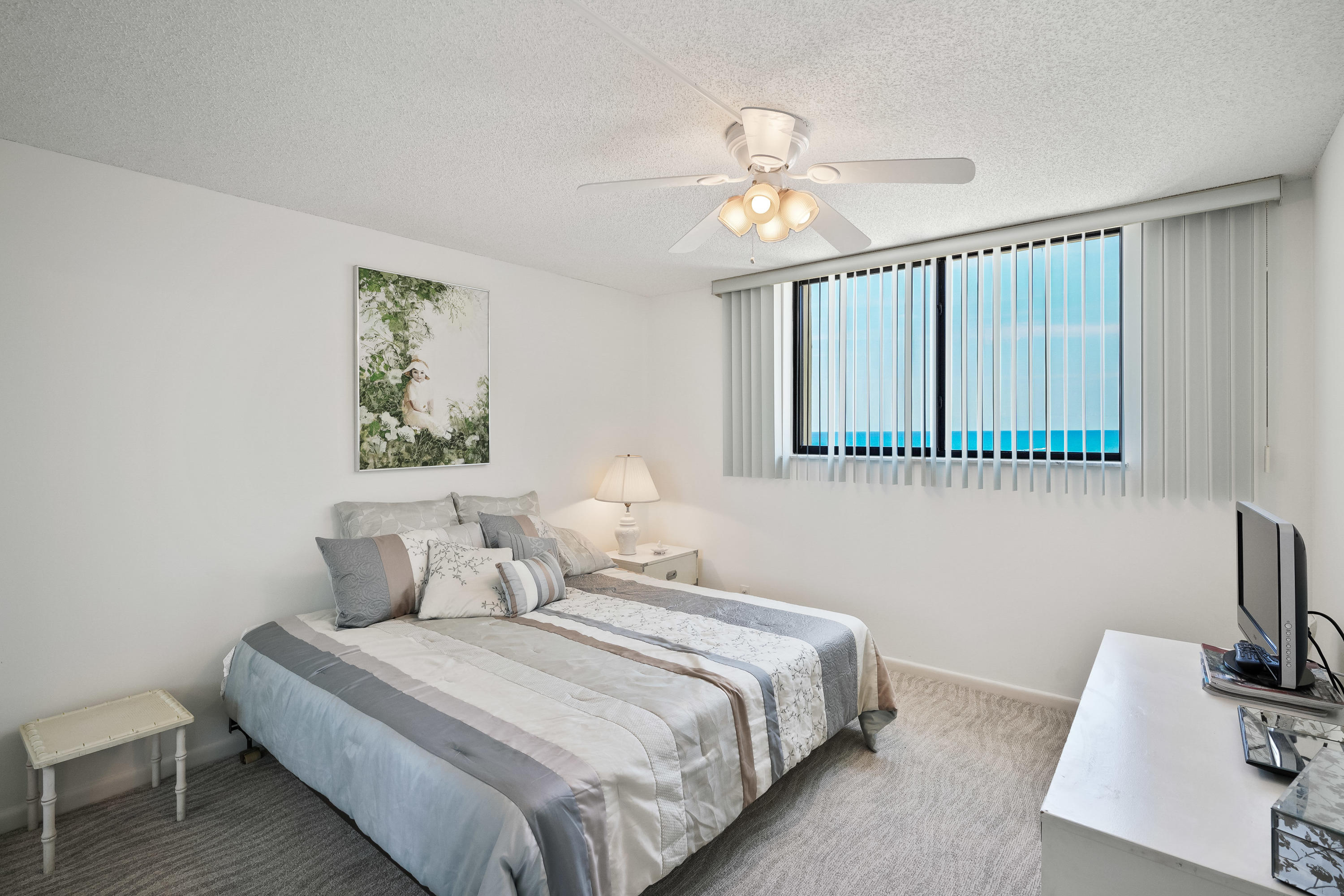200 Ocean Trail Way, Unit 708 Jupiter, FL 33477 - Photo 13 of 23 a bedroom with bed and night stand