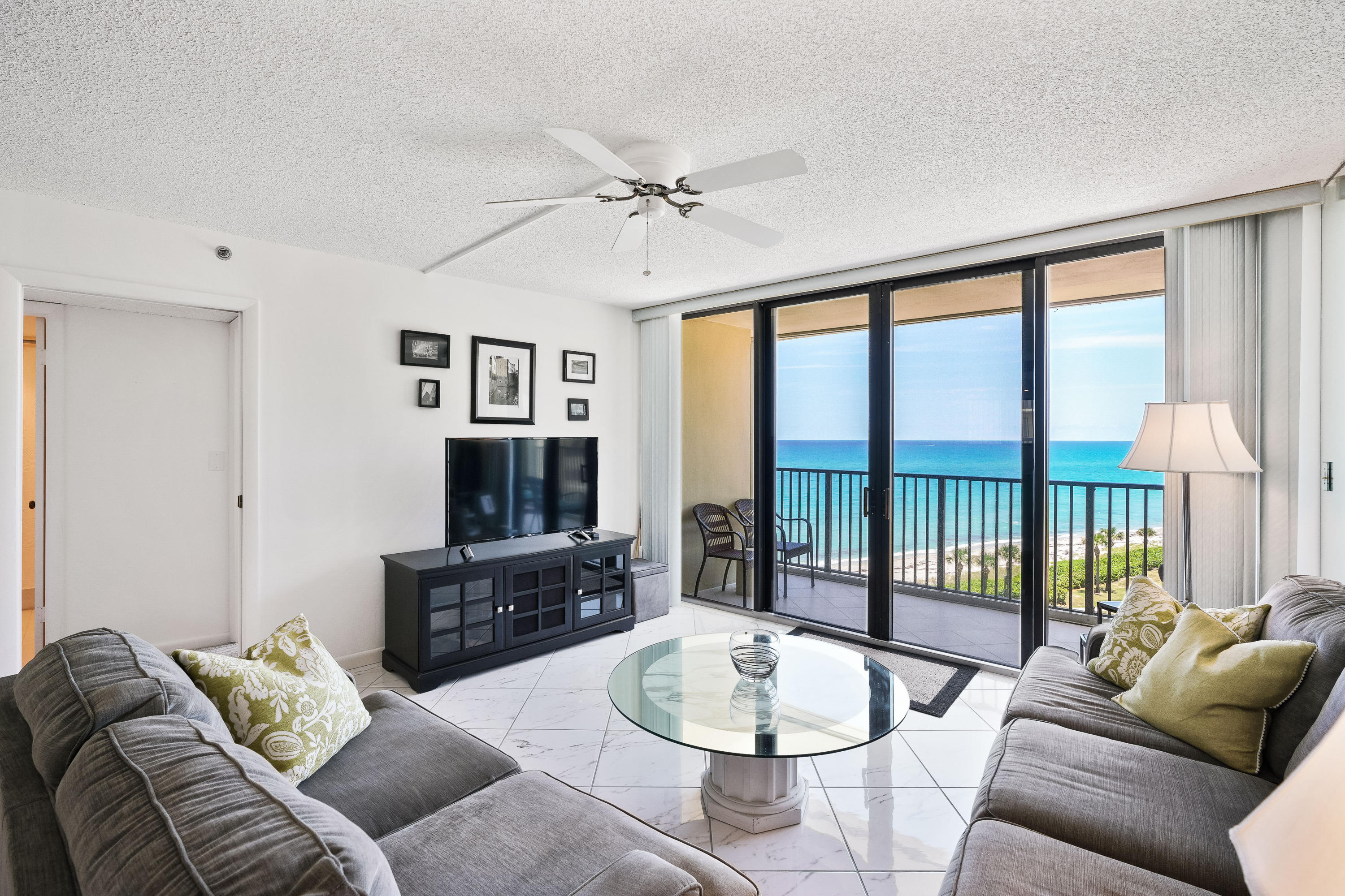200 Ocean Trail Way, Unit 708 Jupiter, FL 33477 - Photo 4 of 23 a living room with furniture and a large window