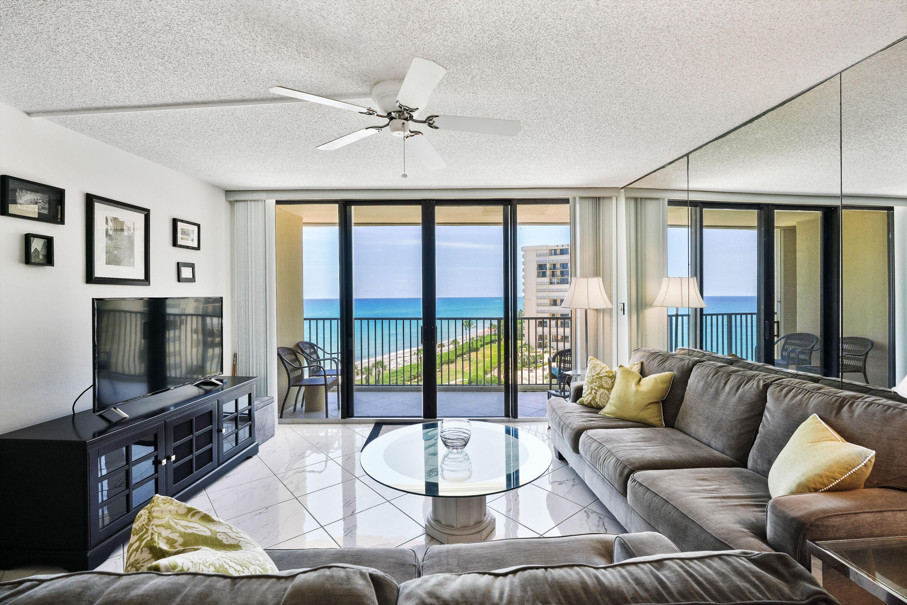 200 Ocean Trail Way, Unit 708 Jupiter, FL 33477 - Photo 6 of 23 a living room with furniture and a flat screen tv