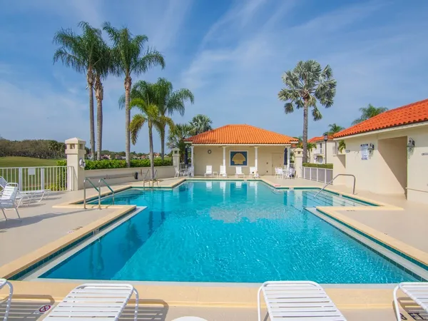 a view of swimming pool with outdoor seating and wooden floor