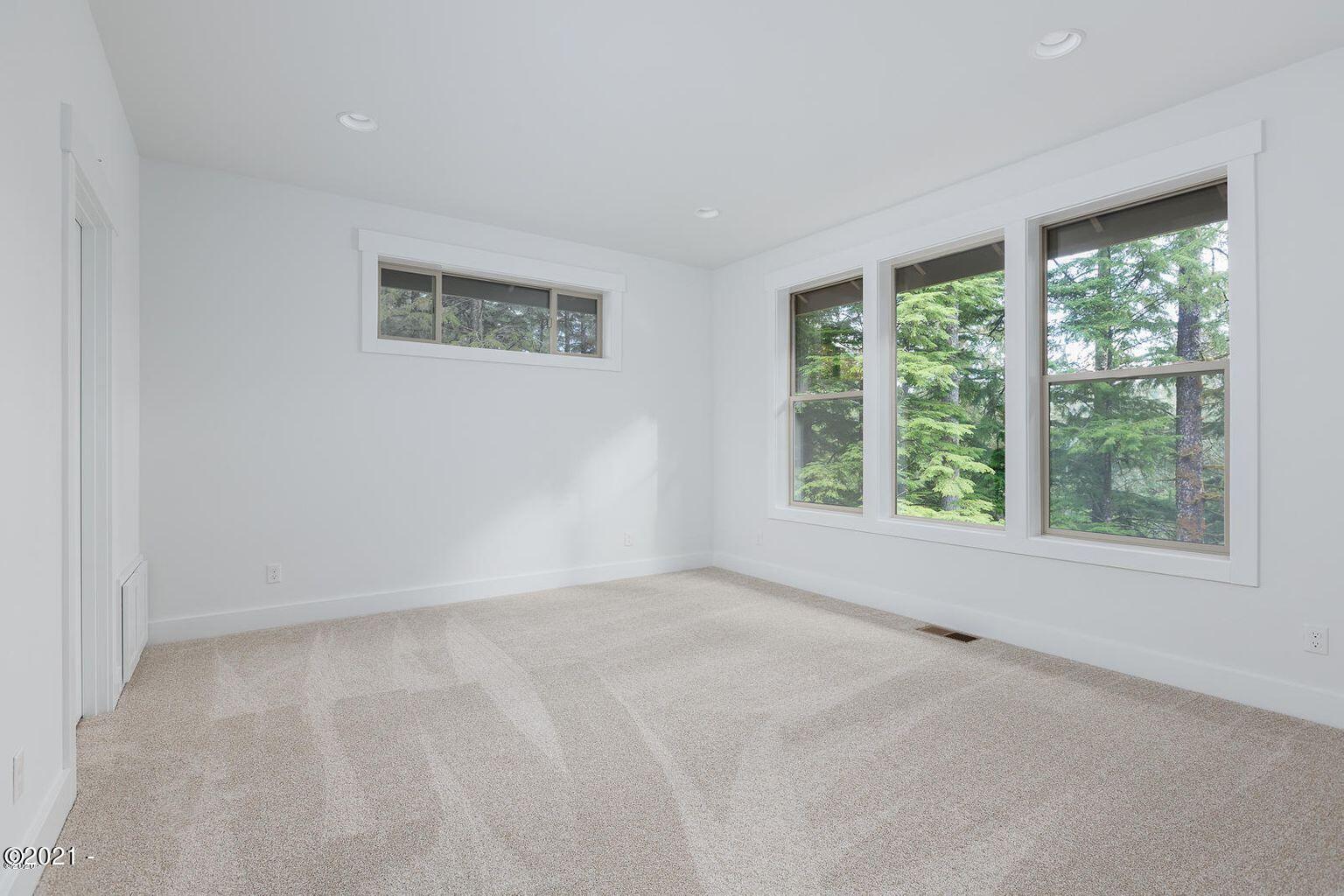 15 Big Tree Road Gleneden Beach, OR 97388 - Photo 19 of 28 a view of an empty room with a window