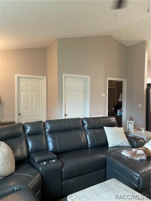 13591 Southwest 112th Street Dunnellon, FL 34432 - Photo 9 of 24 a living room with couches and kitchen view