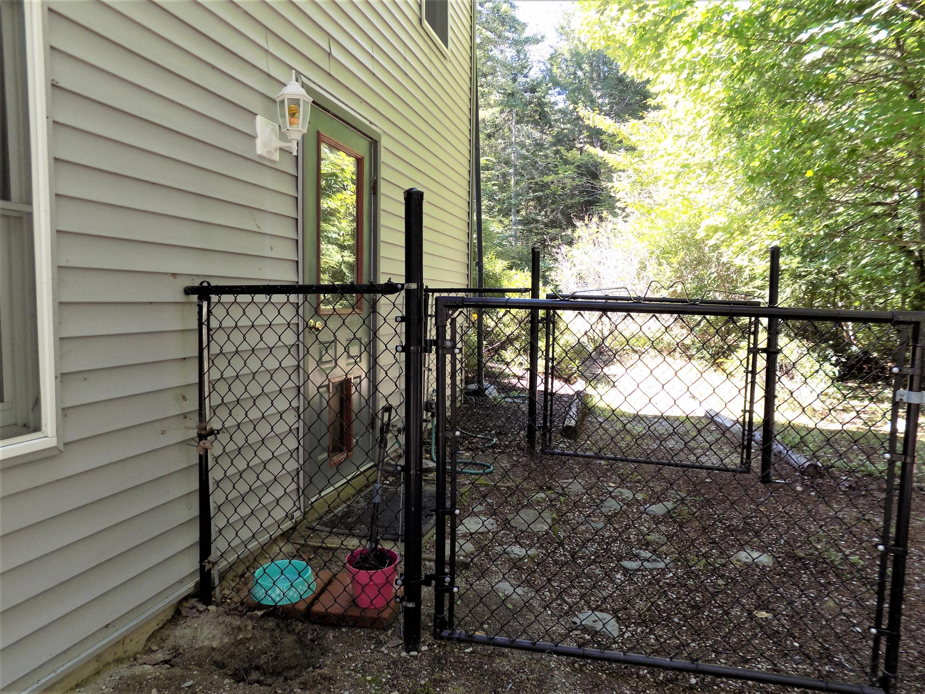 171 Long Point Way Orland, ME 04472 - Photo 37 of 63 pet door access to fenced in area