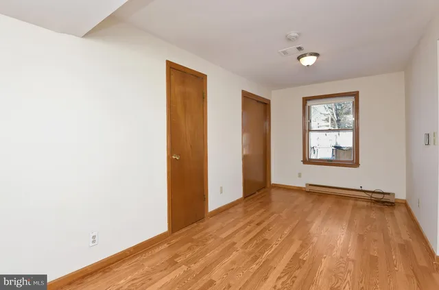 a view of an empty room and window