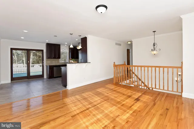 a view of a kitchen with a sink and a refrigerator