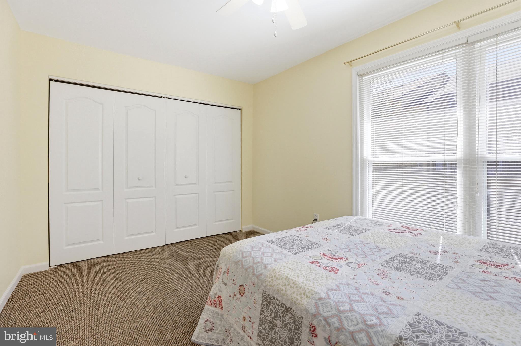 11506 Laurelwalk Drive Laurel, MD 20708 - Photo 24 of 30 a bedroom with a bed and a window