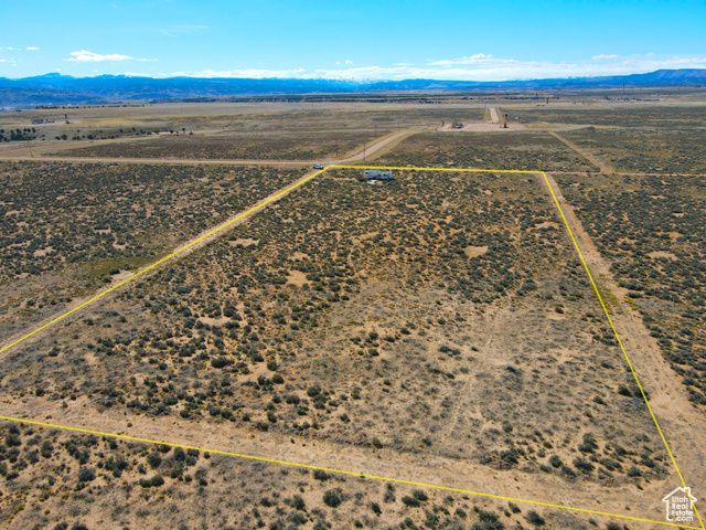 6000 South Well Road East, Unit 6 Duchesne, UT 84021 - Photo 8 of 12 View of rural area with mountains and property parcel outlined