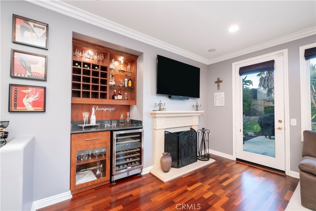20642 Iris Canyon Road Riverside, CA 92508 - Photo 14 of 57 a view of a livingroom with furniture a flat screen tv and fireplace