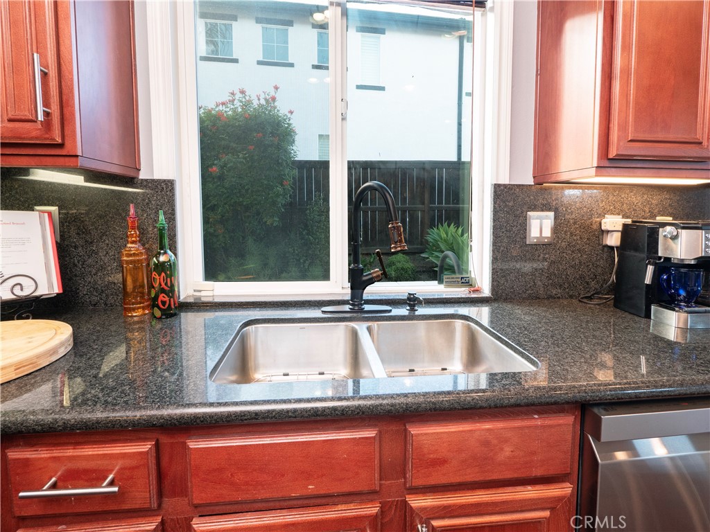 20642 Iris Canyon Road Riverside, CA 92508 - Photo 20 of 57 a kitchen with granite countertop a sink and a window