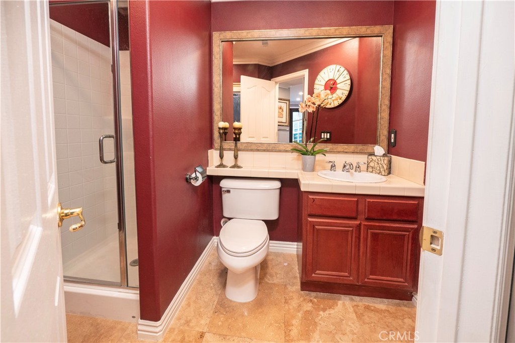 20642 Iris Canyon Road Riverside, CA 92508 - Photo 22 of 57 a bathroom with a toilet sink and mirror