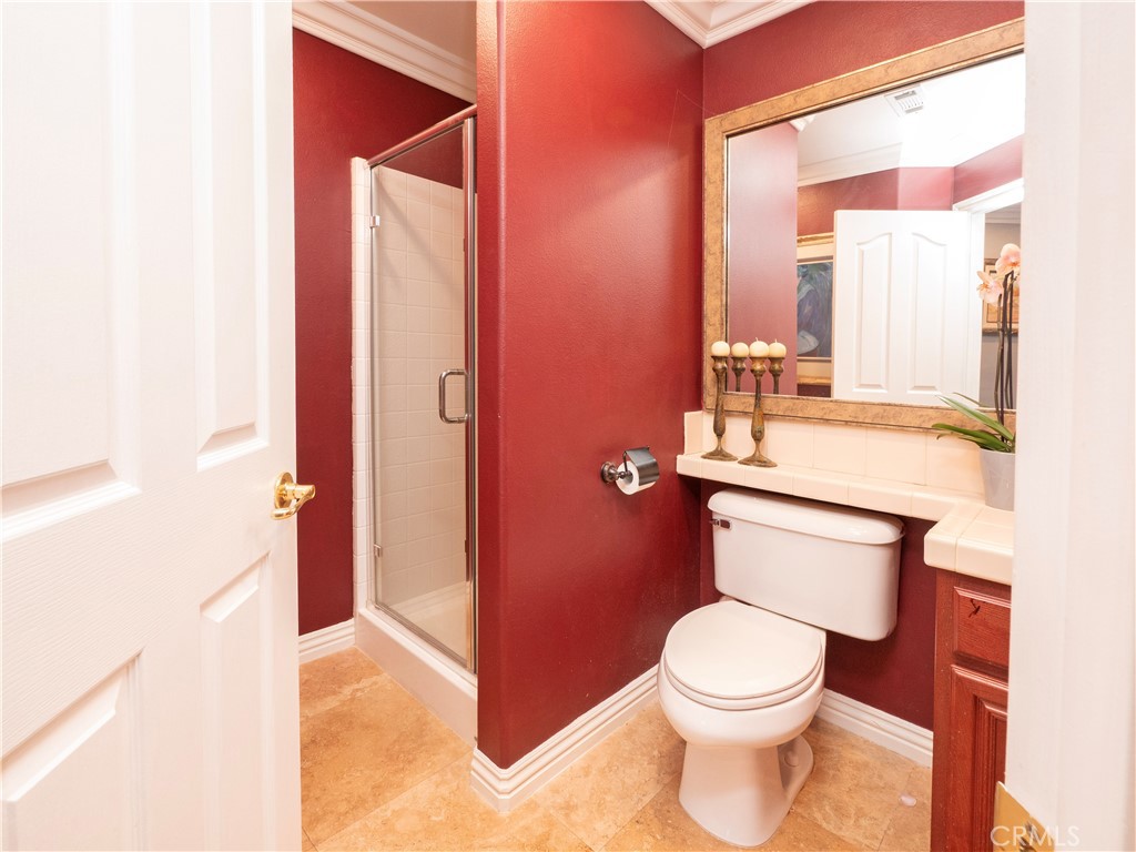 20642 Iris Canyon Road Riverside, CA 92508 - Photo 23 of 57 a bathroom with a toilet a sink and a mirror
