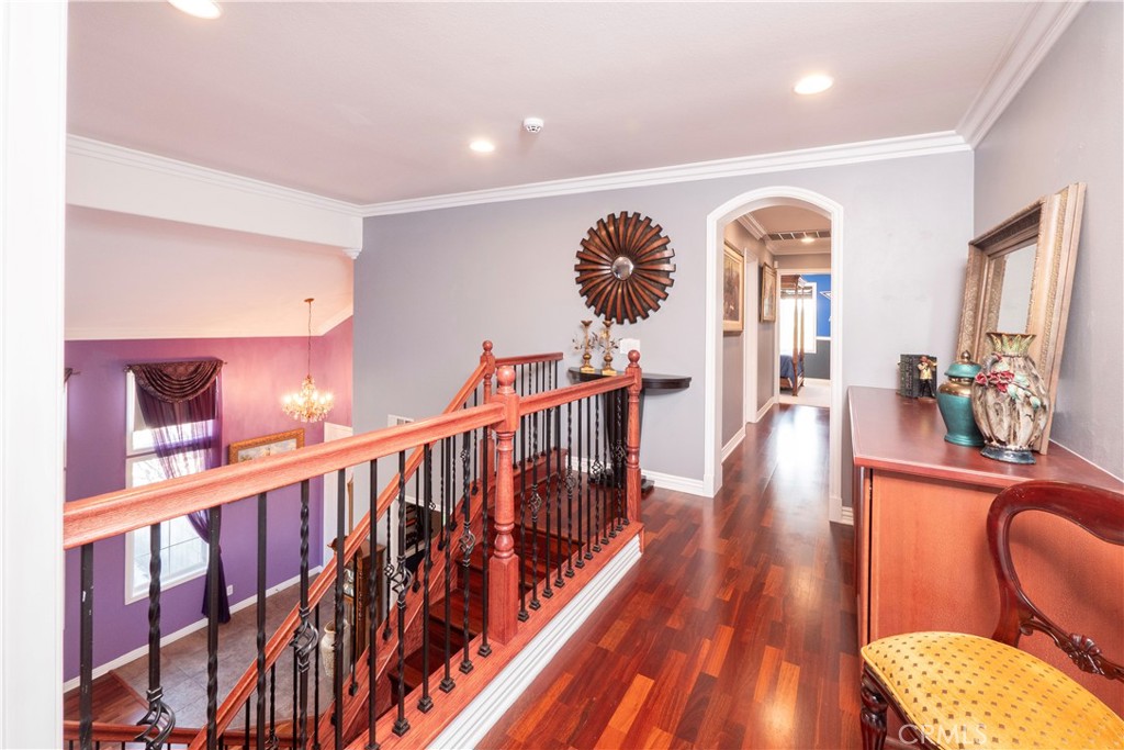 20642 Iris Canyon Road Riverside, CA 92508 - Photo 27 of 57 a view of a hallway with wooden floor and furniture