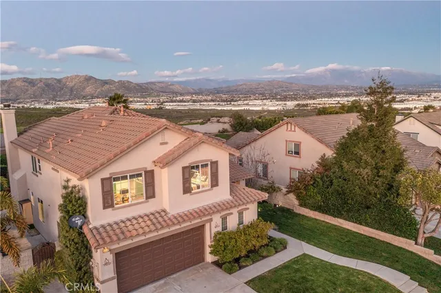 an aerial view of residential houses with outdoor space and river