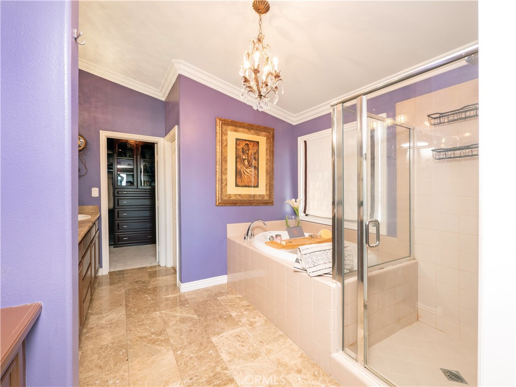 20642 Iris Canyon Road Riverside, CA 92508 - Photo 34 of 57 a spacious bathroom with a large tub shower and window